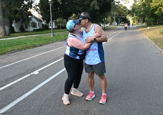 Natalie and Yung Lu running the 2025 Twin Cities 10-Mile Marathon.