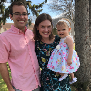 The Hill family outside smiling for a family photo