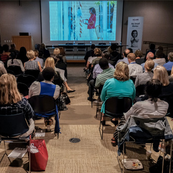 A group of watching the No Small Matter screening