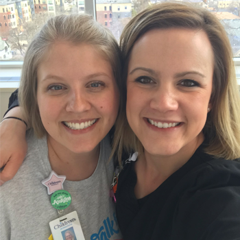 Emily Machones, RN and Megan Vanderheyden, RN of the PICU in Minneapolis smiling in a photo together