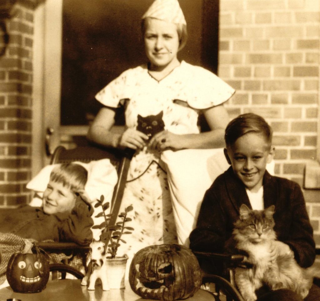 A historic image of a nurse and patients outside Children's Hospital, St. Paul