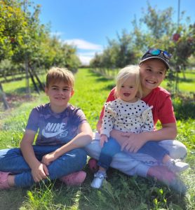 Reed kids at an apple orchard