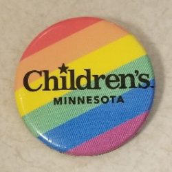Children's PRIDE ERG button with rainbow diagonal stripes and a black Children's logo