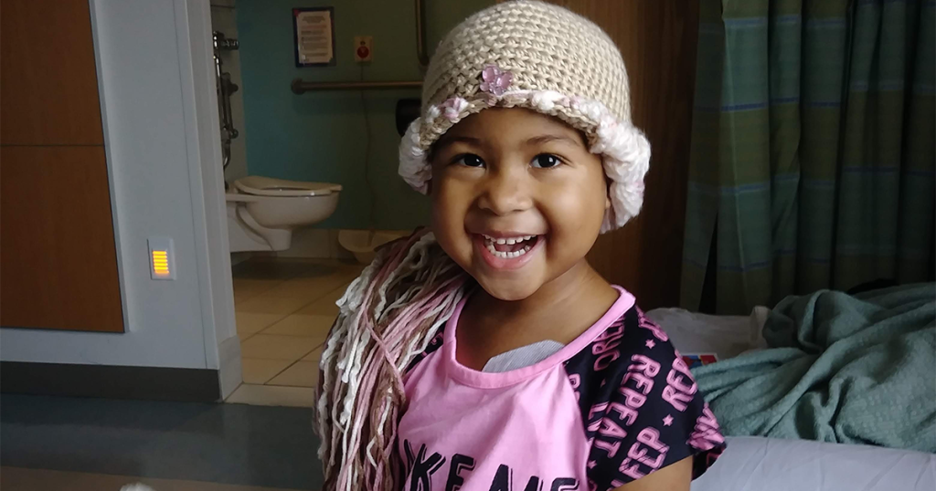 RaZyia at the hospital with a hat on
