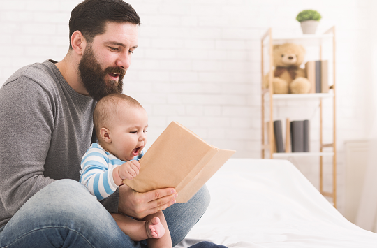 Father reading to baby