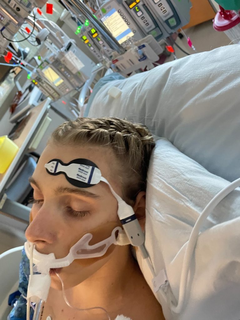 Reese laying in hospital bed