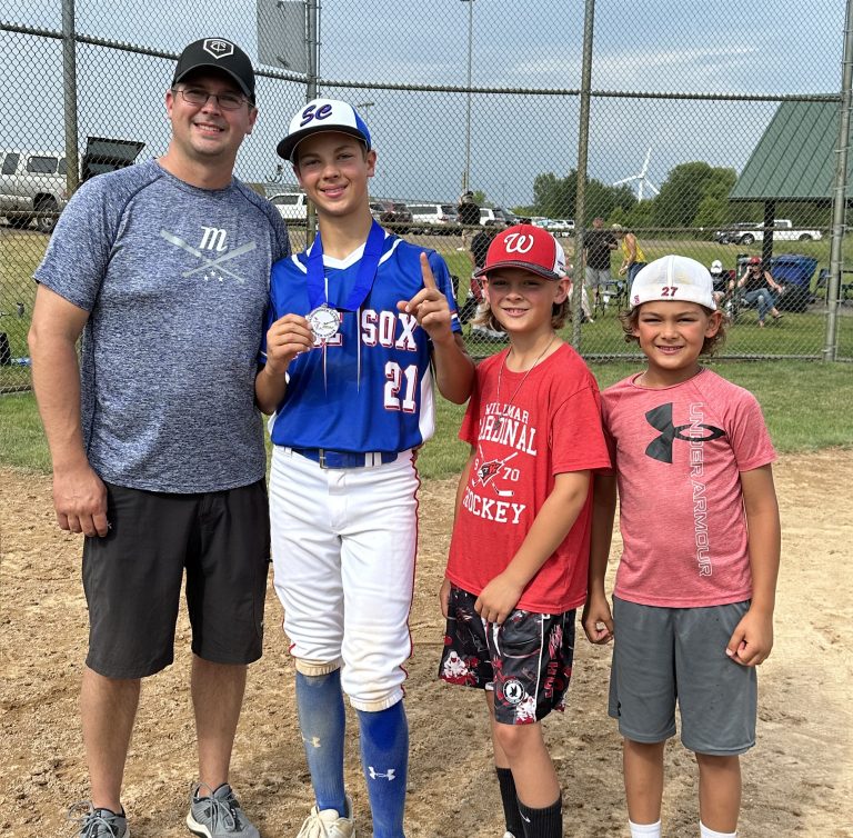 Riley with his dad and brothers