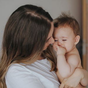 A baby crying with parent