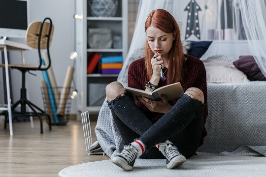 Teenage girl in bedroom