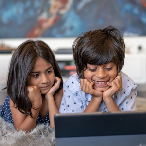 Siblings watching iPad