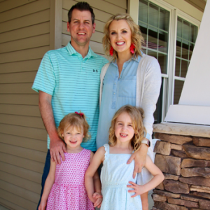 The Yanisch family smiling at home