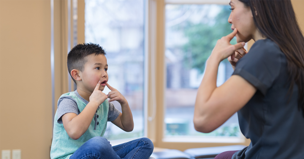 Child working with a speech-language pathologist