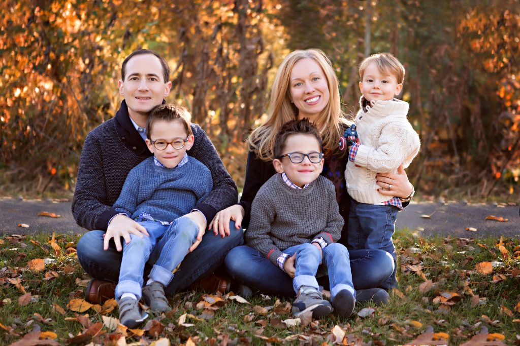 Heather and family sitting outside