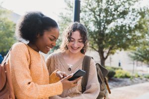 Teen girls looking at phone