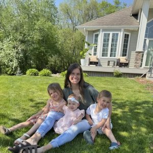 Lilia and her family outside in the yard