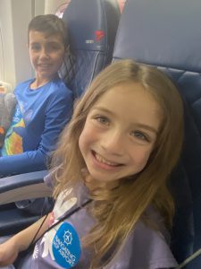Alexa Mendoza and her brother on an airplane