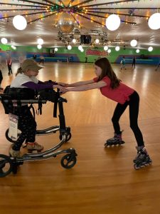 Anna and her friend at Skatesville