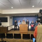Jame Winter speaking at press conference