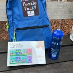 Close up of backpack and puzzle