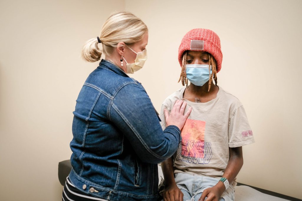 Children's Minnesota doctor helping a cardiovascular patient at the office