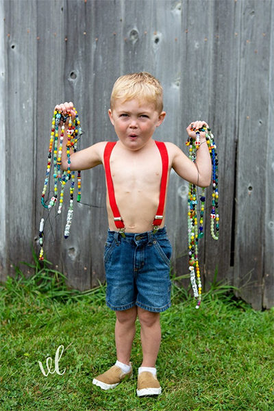 Charlie with his heart beads from his surgeries