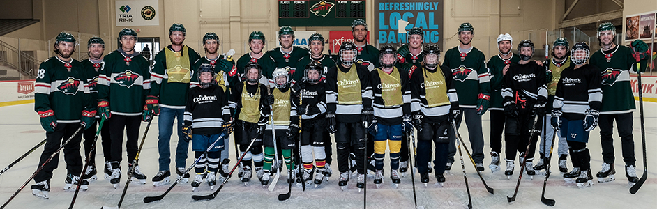Minnesota Wild players with Children's Minnesota patients