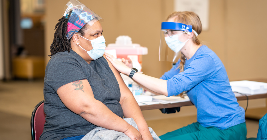 woman getting the COVID-19 vaccine