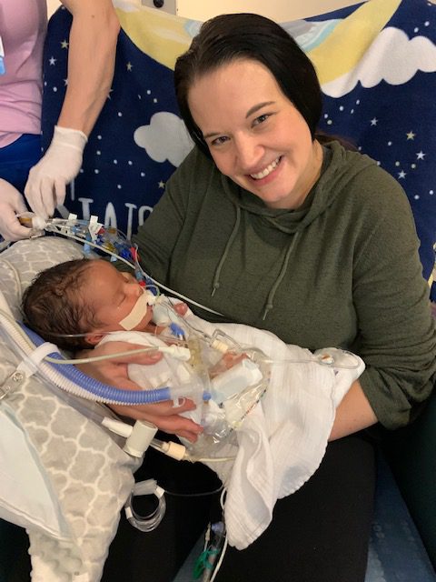 Déjà holding baby Vincent.