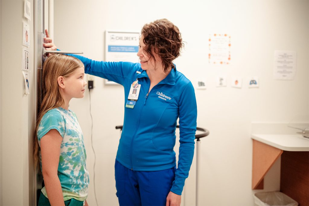 A child getting a well-child check at a primary care clinic
