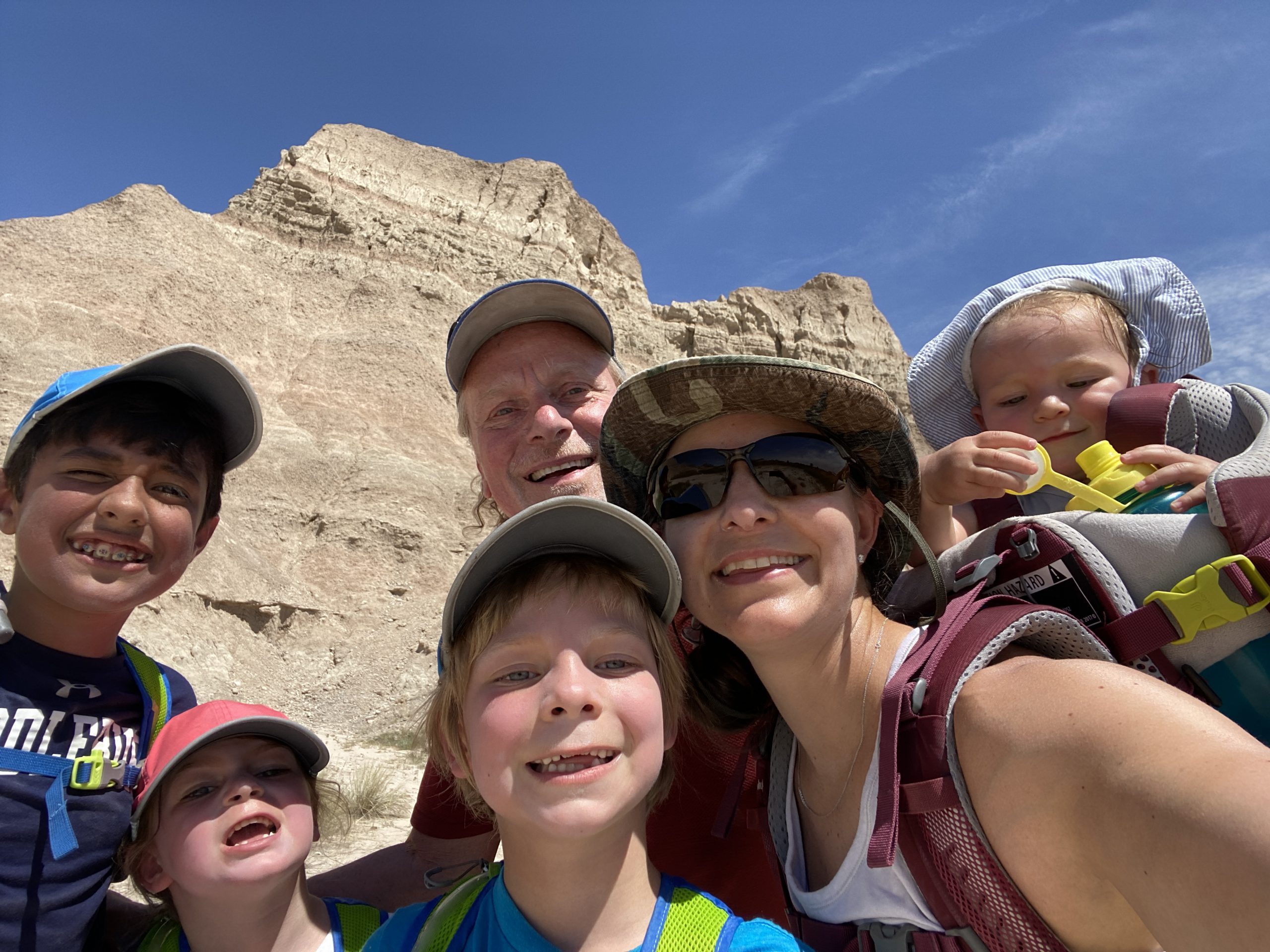 The Wyrobek family smile during a hiking trip