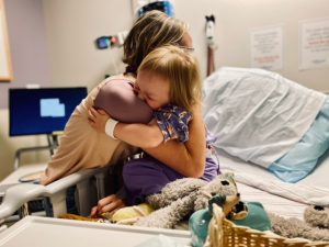 Xenia hugging a provider