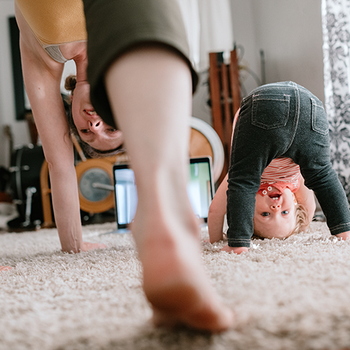 Family doing yoga at home together during COVID-19