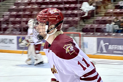 Zander playing hockey on the ice