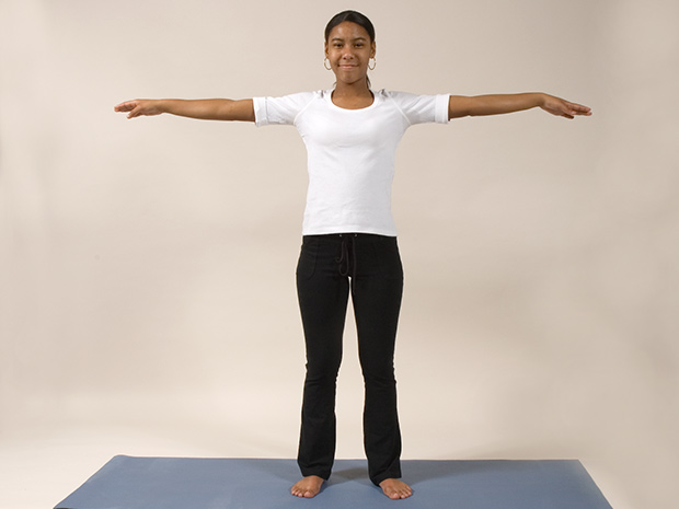 Model demonstrates step 1 of the butterfly breath with her arms out