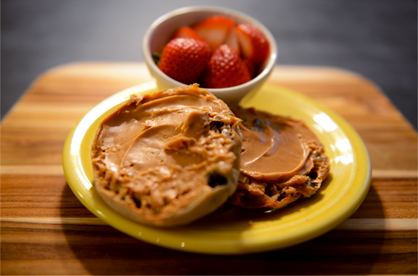 Image of peanut butter on muffin and berries